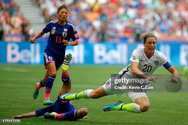Abby Wambach of the United States is fouled from behind by Homare Sawa of Japan in the second half in the FIFA Women's World Cup Canada 2015 Final at...
