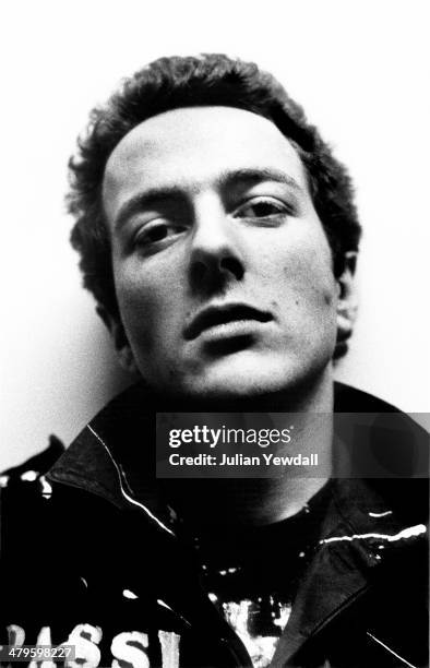 English singer-songwriter Joe Strummer , of punk group The Clash, backstage at a concert at the Royal College of Art , London, 5th November 1976.