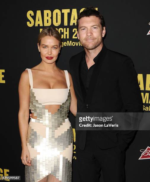Model Lara Bingle and actor Sam Worthington attend the premiere of "Sabotage" at Regal Cinemas L.A. Live on March 19, 2014 in Los Angeles, California.