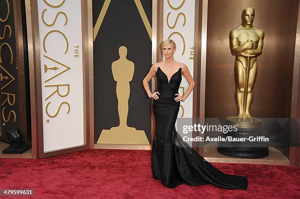 Actress Charlize Theron arrives at the 86th Annual Academy Awards at Hollywood & Highland Center on March 2, 2014 in Hollywood, California.