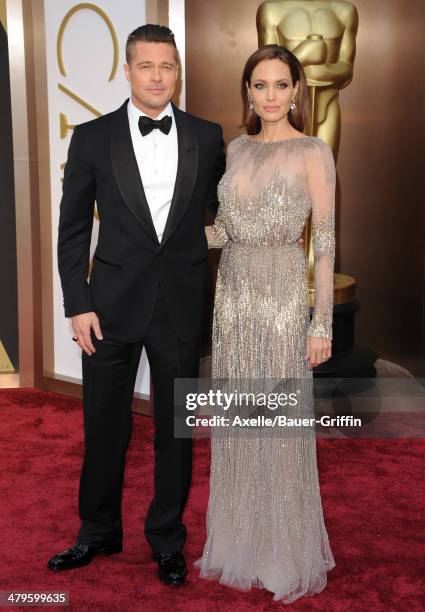 Actors Brad Pitt and Angelina Jolie arrive at the 86th Annual Academy Awards at Hollywood & Highland Center on March 2, 2014 in Hollywood, California.