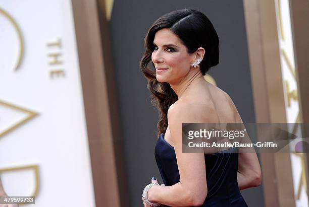 Actress Sandra Bullock arrives at the 86th Annual Academy Awards at Hollywood & Highland Center on March 2, 2014 in Hollywood, California.