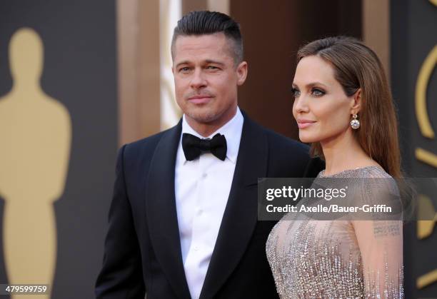 Actors Brad Pitt and Angelina Jolie arrive at the 86th Annual Academy Awards at Hollywood & Highland Center on March 2, 2014 in Hollywood, California.