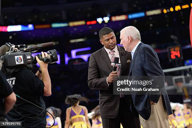 S Jalen Rose interviews Gregg Popovich of the San Antonio Spurs during a timeout in a game against the Los Angeles Lakers at Staples Center on March...