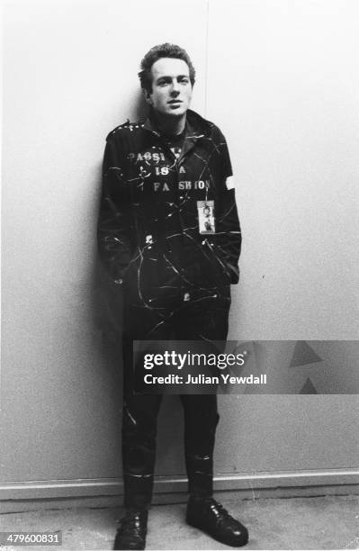 English singer-songwriter Joe Strummer , of punk group The Clash, backstage at a concert at the Royal College of Art , London, 5th November 1976.