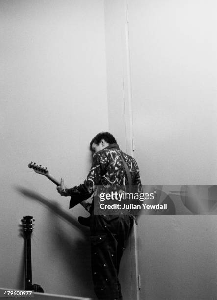 English singer-songwriter Joe Strummer , of punk group The Clash, backstage at a concert at the Royal College of Art , London, 5th November 1976.