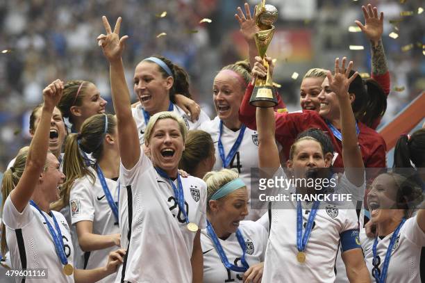 Forward Abby Wambach and teammates their victory in the final football match between USA and Japan during the 2015 FIFA Women's World Cup at the BC...