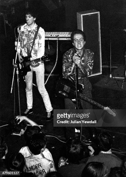 Mick Jones and Joe Strummer performing with British punk group The Clash at the Royal College of Art , London, 5th November 1976.