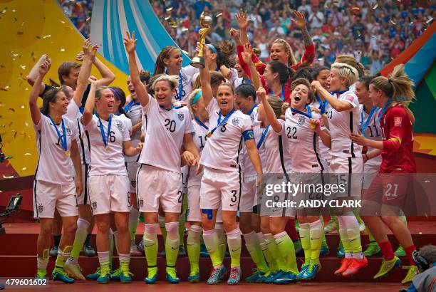 Members of the USA celebrate winning the the championship football match against Japan at during the 2015 FIFA Women's World Cup in Vancouver on July...