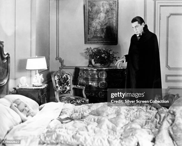 Hungarian actor Bela Lugosi as the vampire Count Dracula and American actress Frances Dade as Lucy Weston in 'Dracula', directed by Tod Browning,...