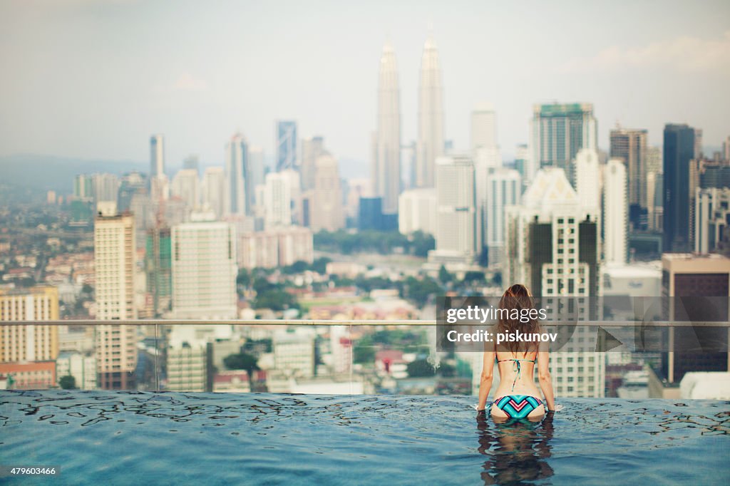 Young Woman in Rooftop Pool