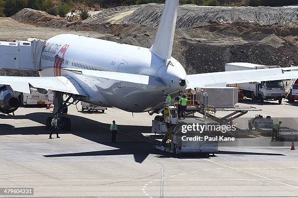 The Aeronexus Corporation's - Boeing 767 used by the Rolling Stones is inspected by flight crew and engineers in readiness for takeoff at Perth...