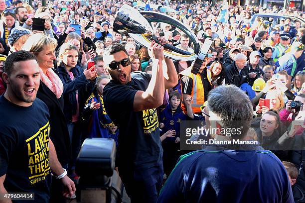 Lima Sopoaga of the Highlanders poses with the trophy during a street parade to celebrate the Highlanders Super Rugby Grand Final victory, on July 6,...