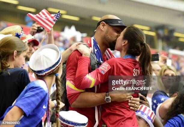 Goalkeeper Hope Solo is kissed by husband Jerramy Stevens after winning the final football match between USA and Japan during their 2015 FIFA Women's...