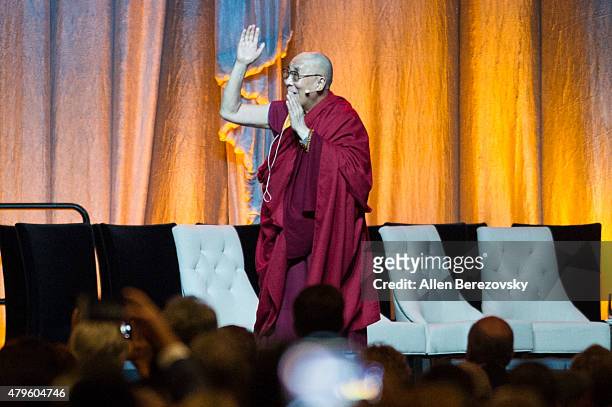 His Holiness the Dalai Lama walks onstage during his 80th birthday celebration and Global Compassion Summit at Honda Center on July 5, 2015 in...