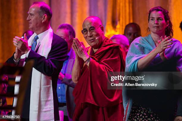 His Holiness the Dalai Lama celebrates onstage during his 80th birthday celebration and Global Compassion Summit at Honda Center on July 5, 2015 in...