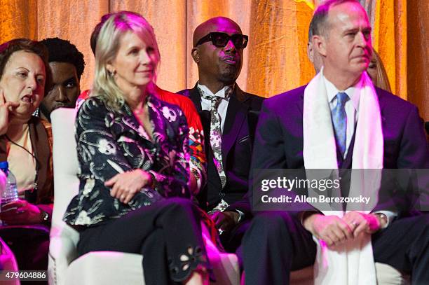 Recording artist MC Hammer and Mayor of Anaheim Tom Tait sit onstage during His Holiness the 14th Dalai Lama's 80th birthday and Global Compassion...