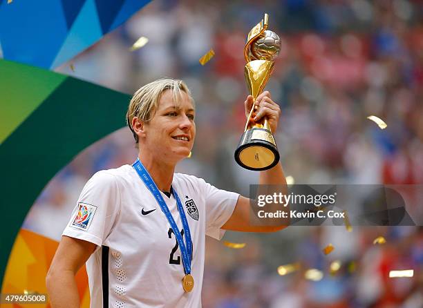 Abby Wambach of the United States of America holds the World Cup Trophy after their 5-2 over Japan in the FIFA Women's World Cup Canada 2015 Final at...