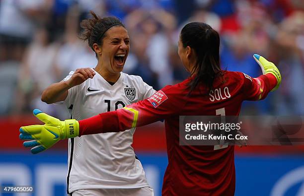 Carli Lloyd of the United States of America celebrates after her third goal against Japan with goalkeeper Hope Solo in the FIFA Women's World Cup...