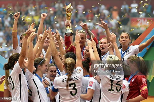The United States celebrates with the World Cup Trophy after their 5-2 win over Japan in the FIFA Women's World Cup Canada 2015 Final at BC Place...