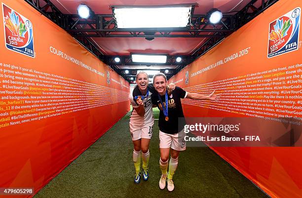 Alex Morgan of USA and Heather O'Reilly of USA celebrate after winning the FIFA Women's World Cup 2015 Final between USA and Japan at BC Place...