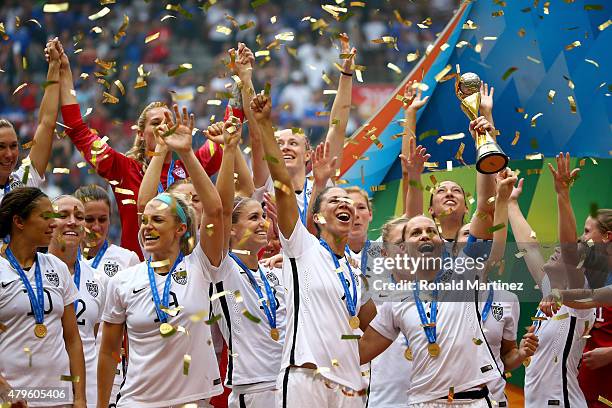 Christie Rampone of the United States of America holds the World Cup Trophy after their 5-2 win over Japan in the FIFA Women's World Cup Canada 2015...