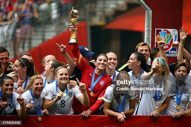 Goalkeeper Hope Solo of the United States of America holds the World Cup Trophy after their 5-2 win over Japan in the FIFA Women's World Cup Canada...