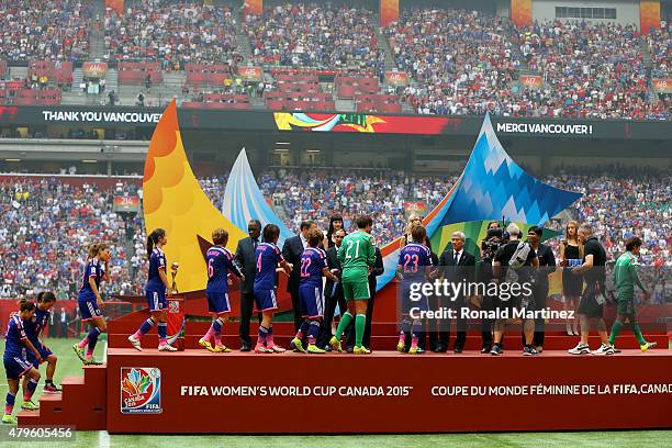 Japan accepts their second place medals after their 5-2 loss to the United States of America in the FIFA Women's World Cup Canada 2015 Final at BC...