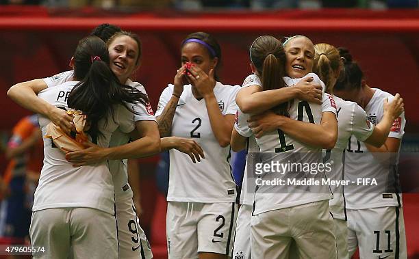 Julie Johnston of United States of America, Morgan Brian, Christen Press and Heather O'Reilly celebrate after winning the FIFA Women's World Cup 2015...