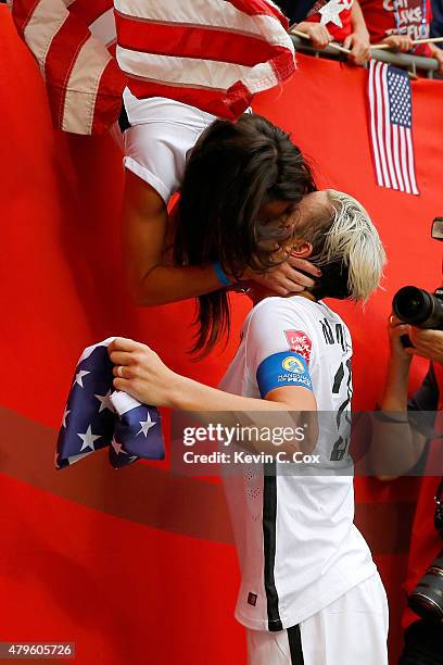 Abby Wambach of the United States celebrates with wife Sarah Huffman after the USA's 5-2 victory against Japan in the FIFA Women's World Cup Canada...