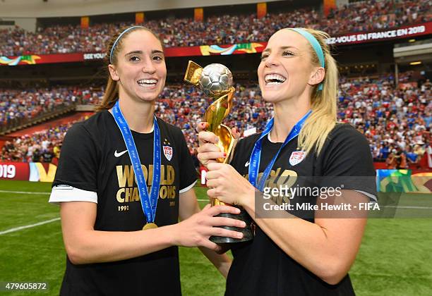 Morgan Brian and Julie Johnston of USA celebrate with the Winner's Trophy after the FIFA Women's World Cup 2015 Final between USA and Japan at BC...