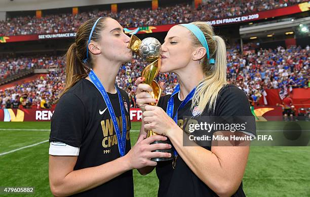 Morgan Brian and Julie Johnston of USA celebrate with the Winner's Trophy after the FIFA Women's World Cup 2015 Final between USA and Japan at BC...