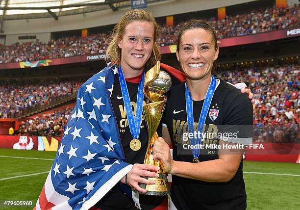 Alyssa Naeher and Alex Krieger of USA hold the Winner's Trophy at the end of the FIFA Women's World Cup 2015 Final between USA and Japan at BC Place...