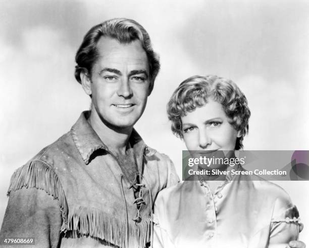 American actors Alan Ladd and Jean Arthur in a promotional portrait for 'Shane', directed by George Stevens, 1953.