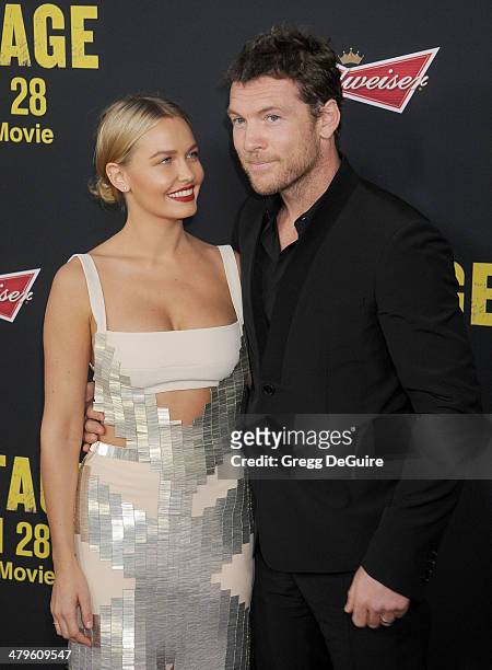 Actor Sam Worthington and Lara Bingle arrive at the Los Angeles premiere of "Sabotage" at Regal Cinemas L.A. Live on March 19, 2014 in Los Angeles,...