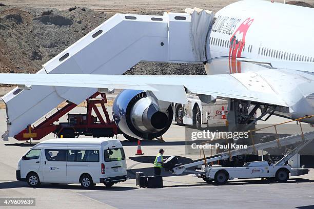 Baggage is loaded onto the Aeronexus Corporation's - Boeing 767 used by the Rolling Stones while being prepared in readiness for takeoff at Perth...