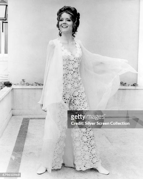 English actress Diana Rigg wearing a lace outfit in a promotional ...