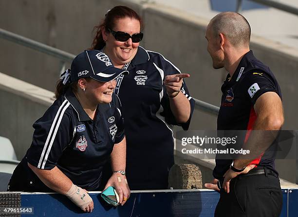 Crows coach Brenton Sanderson, a former Cats, is welcomed by Cat fans during the round one AFL match between the Geelong Cats and the Adelaide Crows...