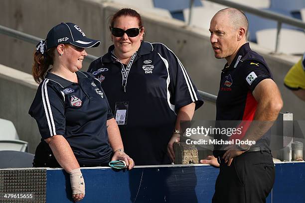 Crows coach Brenton Sanderson, a former Cats, is welcomed by Cat fans during the round one AFL match between the Geelong Cats and the Adelaide Crows...