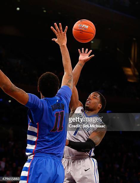 Austin Chatman of the Creighton Bluejays in action against Forrest Robinson of the DePaul Blue Demonsduring the quarterfinals of the Big East...
