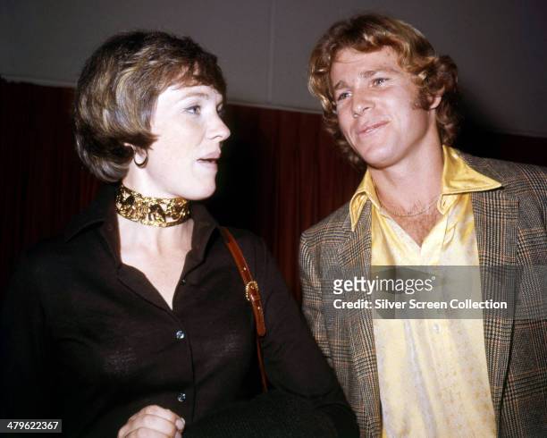 English actress Julie Andrews with American actor Ryan O'Neal, circa 1972.