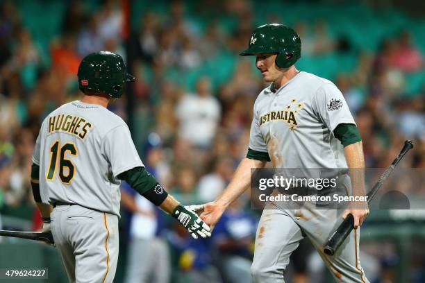 Mitch Dening of Australia crosses home plate during the match between Team Australia and the LA Dodgers at Sydney Cricket Ground on March 20, 2014 in...