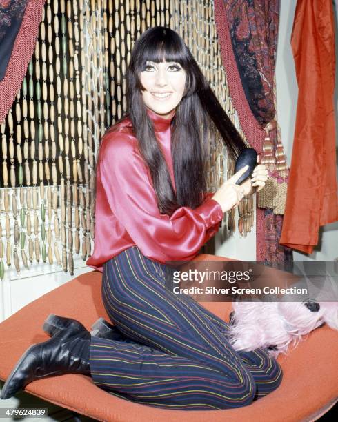 American pop singer and actress Cher brushing her hair, circa 1968. News  Photo - Getty Images