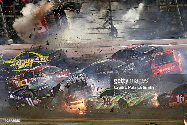 Austin Dillon, driver of the Bass Pro Shops Chevrolet, is involved in an on-track incident following the checkered flag during the NASCAR Sprint Cup...