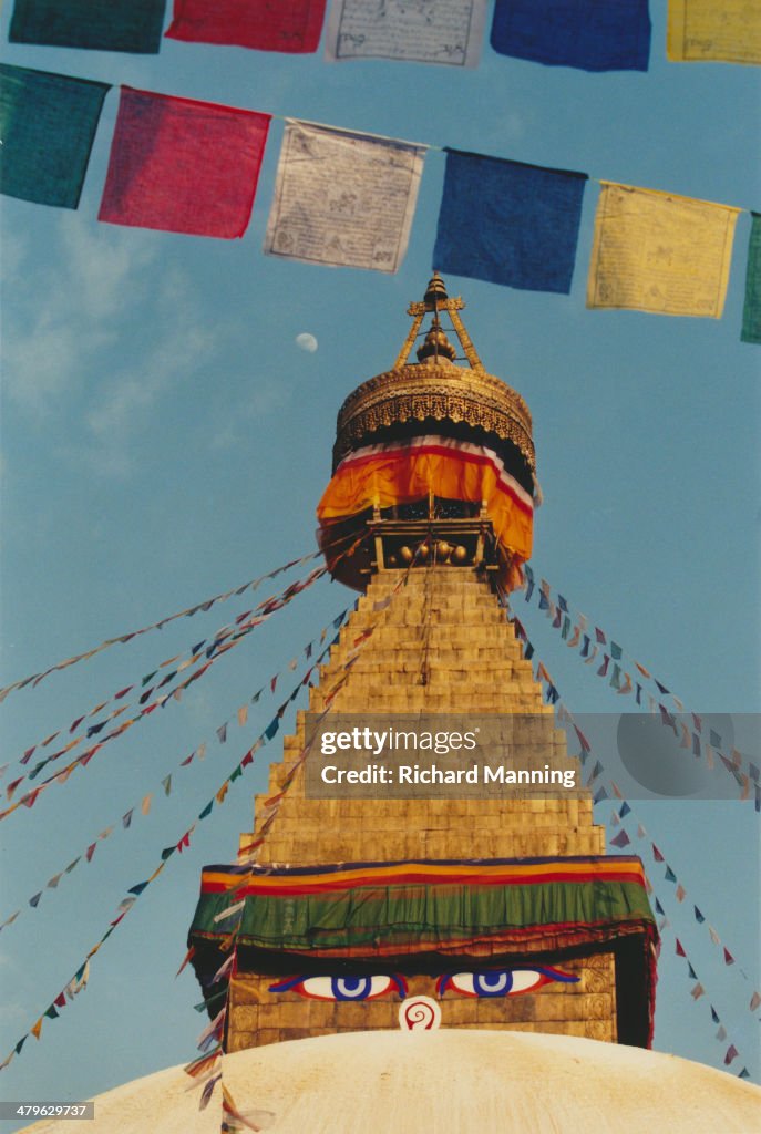 Buddhas Eyes, Prayer Flags And Moon at Boudhanath