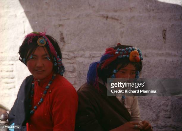 Khampa girls by the Jokhang in Lhasa during Martial Law in March 1989. Lhasa was known as the Forbidden City when Heinrich Harrer reached it in 1944,...