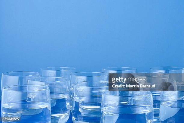 twelve glasses of water  - large group of objects stock pictures, royalty-free photos & images