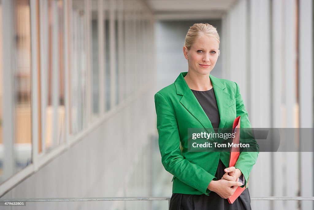 Businesswoman carrying file