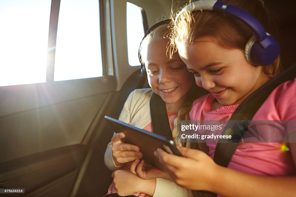 Watching cartoons on their car trip