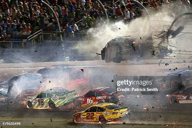 Austin Dillon, driver of the Bass Pro Shops Chevrolet, is involved in an on-track incident following the checkered flag during the NASCAR Sprint Cup...